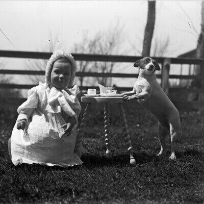 old photo of a little girl and her puppy 